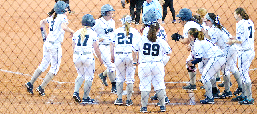 (Alex Compte greeted after home run | Photo by Christa Baier)